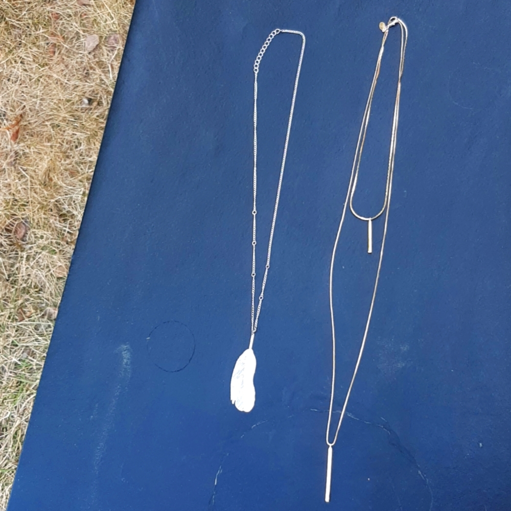 2 neclaces: 1 silver leaf, gold straight pendants
